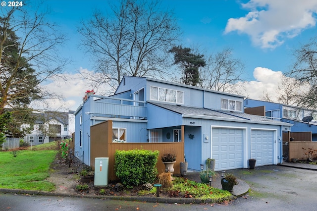 view of front of house with a balcony and a garage