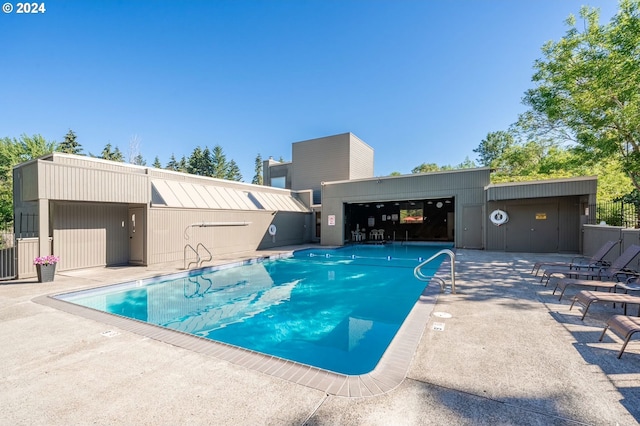 pool with a patio area