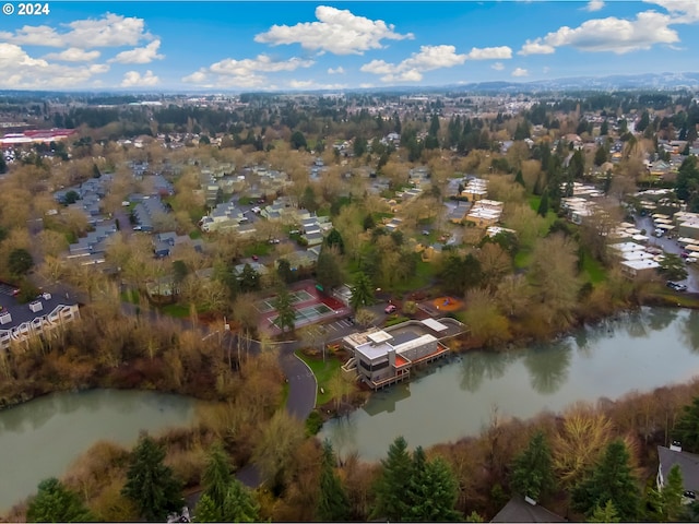 drone / aerial view with a water view and a residential view