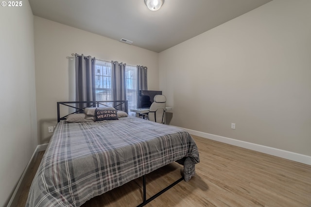 bedroom featuring hardwood / wood-style flooring