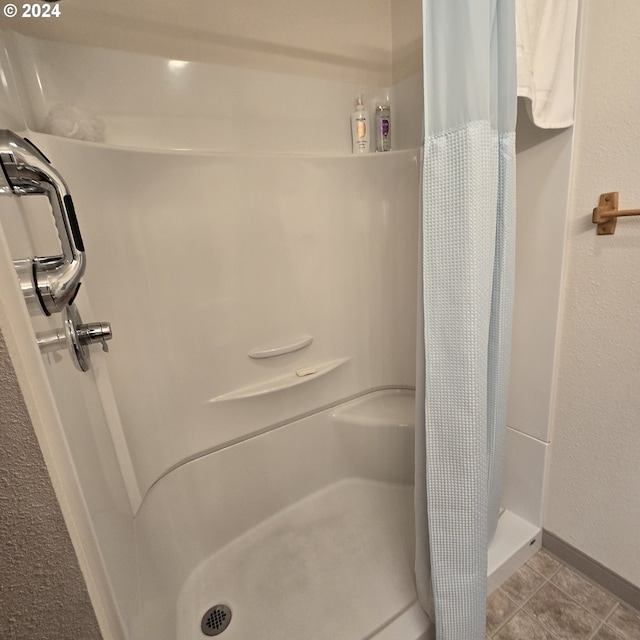 bathroom featuring tile patterned floors and walk in shower