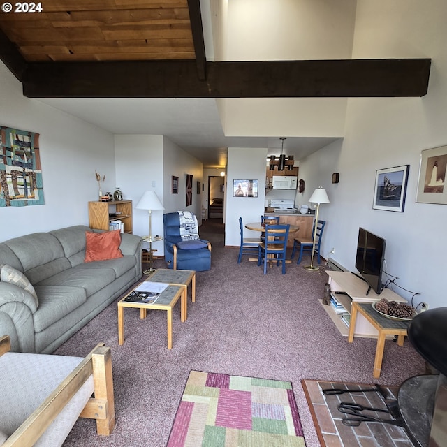 carpeted living room featuring beam ceiling and a chandelier