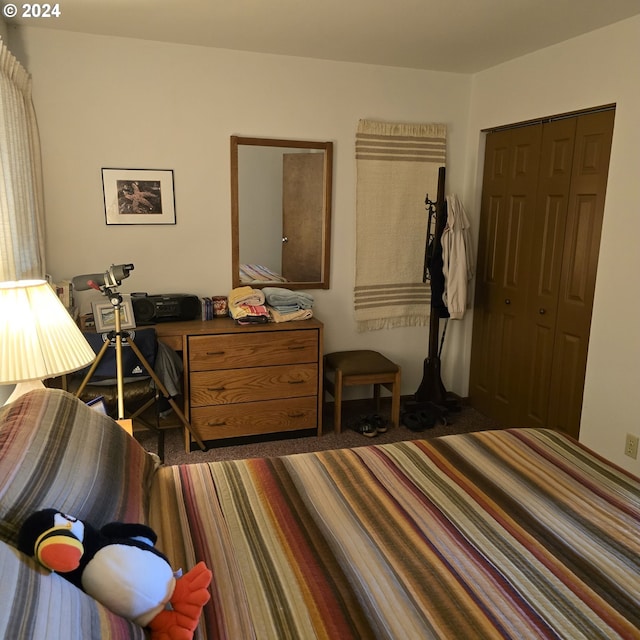bedroom featuring a closet and carpet floors