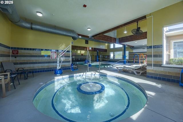 view of pool with an indoor in ground hot tub