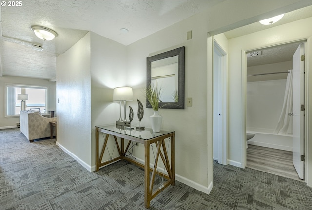 corridor with a textured ceiling