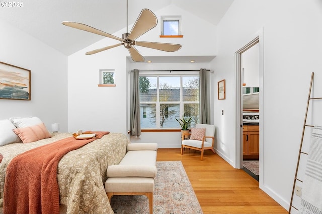 bedroom featuring lofted ceiling, light wood-type flooring, and ceiling fan