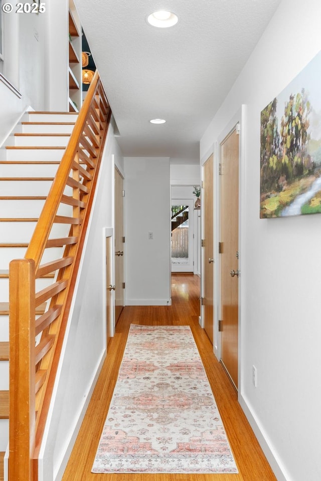 hallway with light wood-type flooring