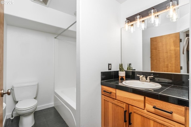 full bathroom featuring toilet, vanity, tile patterned floors, and bathtub / shower combination