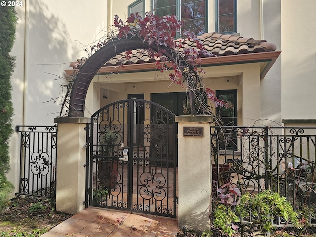 view of gate with a fenced front yard