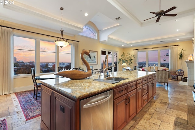 kitchen featuring a kitchen island with sink, a healthy amount of sunlight, pendant lighting, and dishwasher