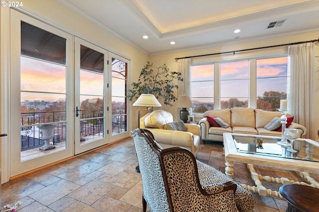 interior space with recessed lighting, visible vents, a tray ceiling, stone tile flooring, and crown molding