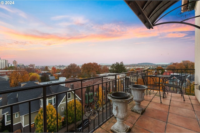 view of balcony at dusk