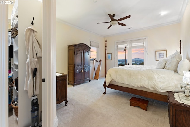 carpeted bedroom featuring ornamental molding, access to outside, and ceiling fan