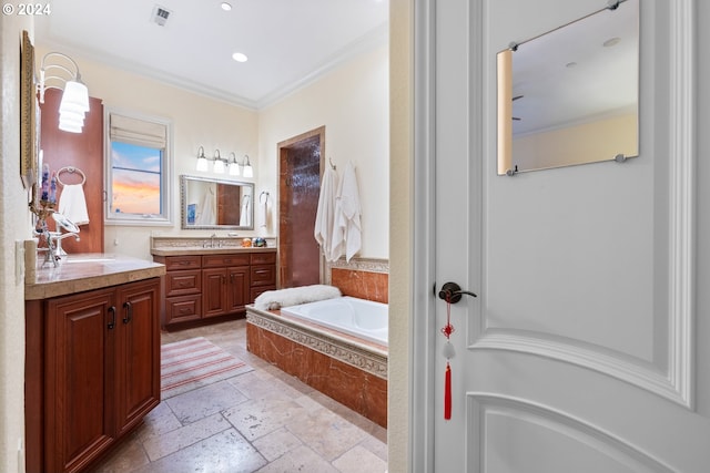 bathroom featuring vanity, tiled bath, and crown molding