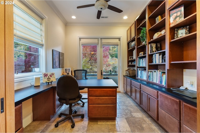 home office with built in desk, ceiling fan, and crown molding