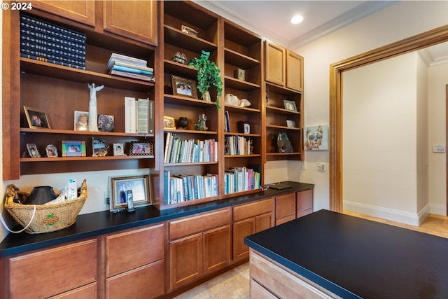 tiled office featuring built in desk and ornamental molding