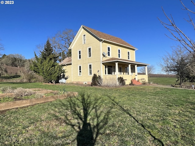 exterior space featuring a yard and covered porch