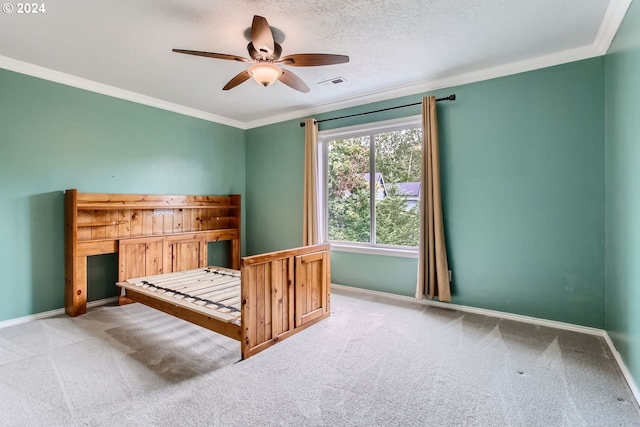 unfurnished bedroom featuring carpet, visible vents, and crown molding