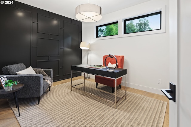 home office with light wood finished floors and baseboards