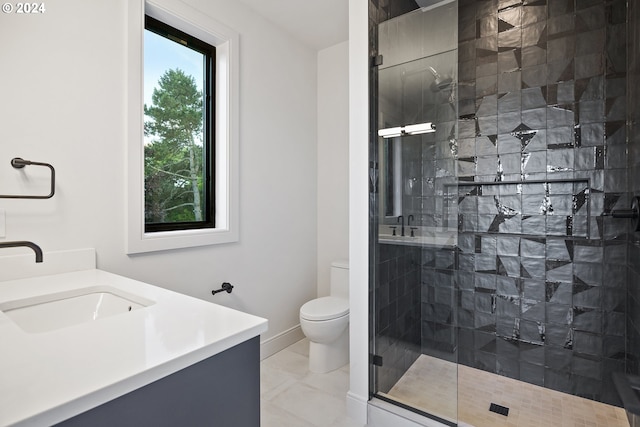 bathroom with toilet, vanity, tile patterned floors, and a shower with door