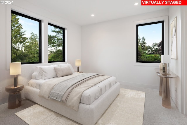 bedroom featuring baseboards, carpet flooring, and recessed lighting
