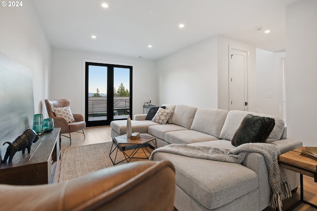 living room featuring light hardwood / wood-style floors and french doors