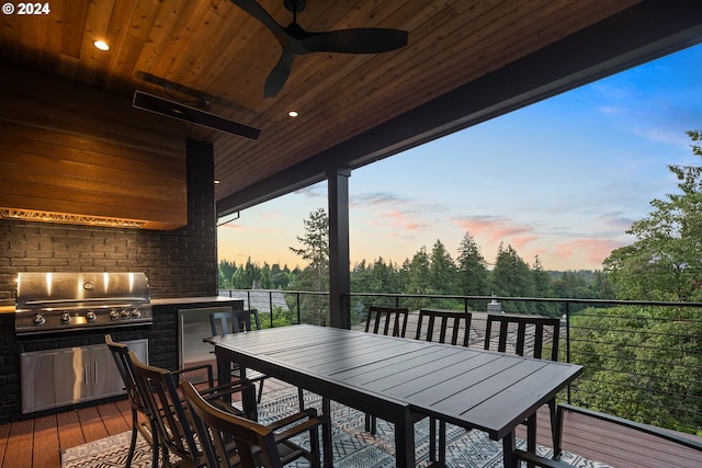 exterior space featuring a ceiling fan, outdoor dining space, a grill, and area for grilling