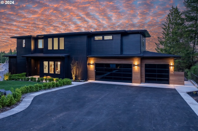 modern home featuring aphalt driveway