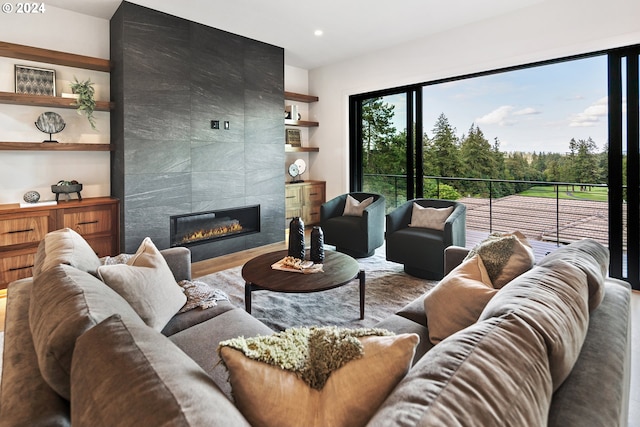 living area featuring a fireplace and recessed lighting