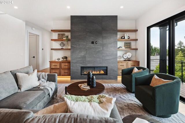 living room featuring sink and light hardwood / wood-style floors