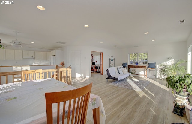 dining area featuring ceiling fan and light hardwood / wood-style floors