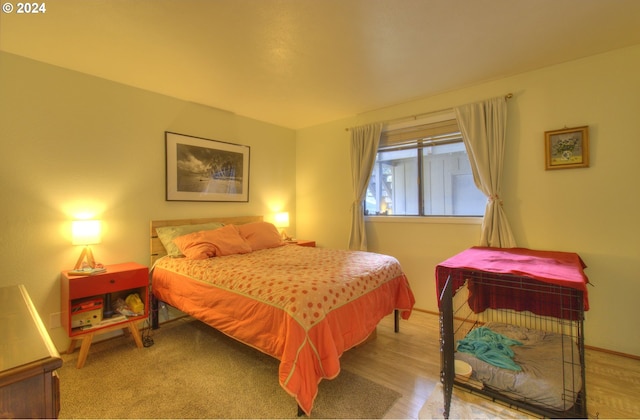 bedroom with light hardwood / wood-style floors