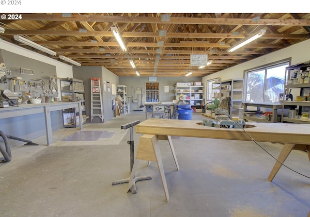 interior space with a workshop area and concrete flooring