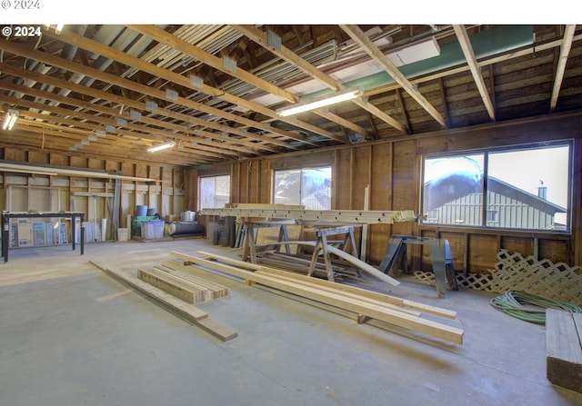 miscellaneous room featuring concrete floors and plenty of natural light