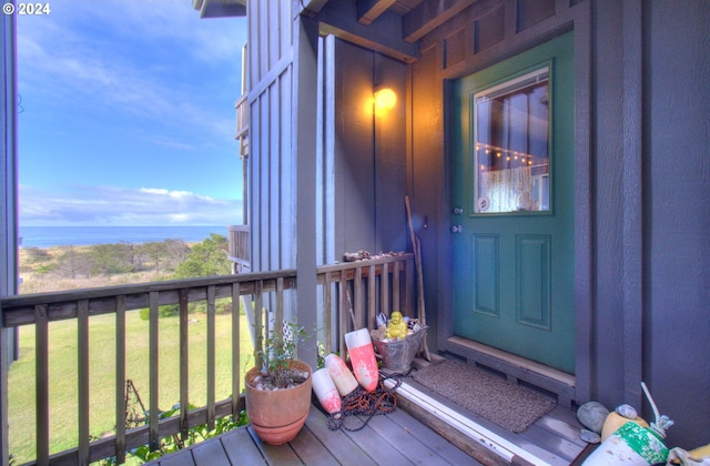 29134 Ellensburg Ave Unit 2, Gold Beach, OR 97444 - entrance to property with a yard, a water view, and board and batten siding