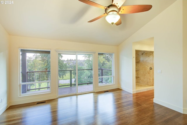 unfurnished room featuring hardwood / wood-style flooring and lofted ceiling