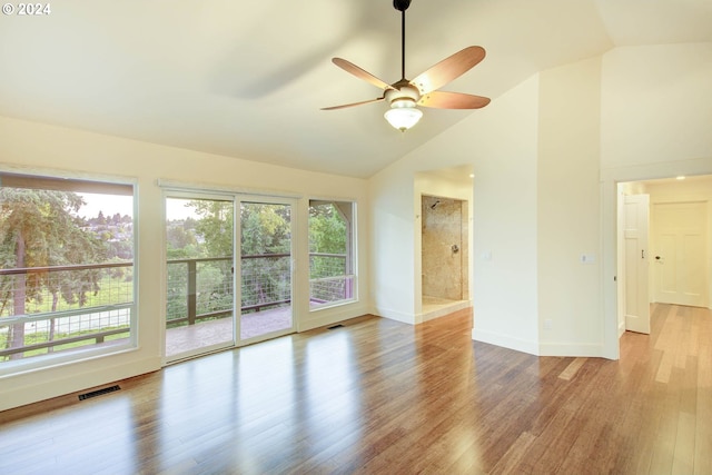 interior space featuring vaulted ceiling, ceiling fan, light hardwood / wood-style floors, and plenty of natural light