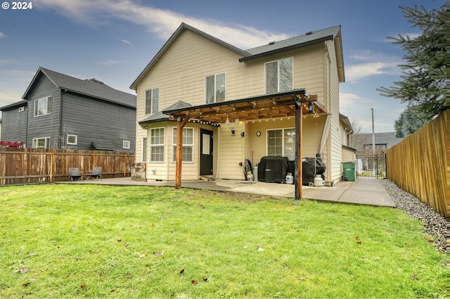 rear view of property featuring a patio area, a pergola, and a yard