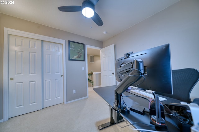 workout area with light colored carpet and ceiling fan