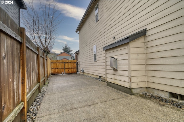 view of side of home with a patio area