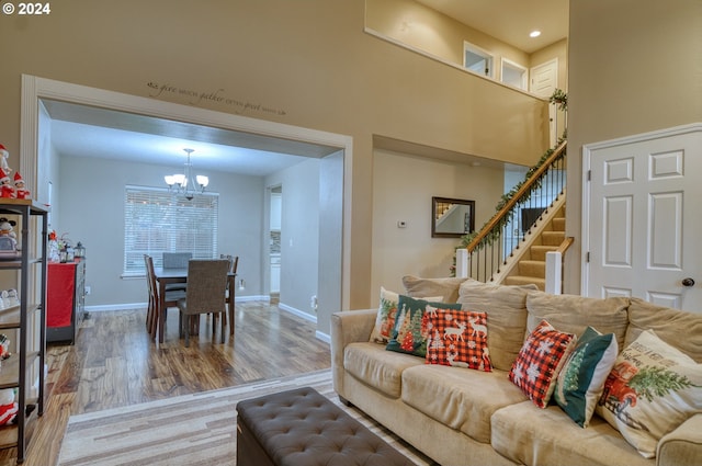 living room with a chandelier and hardwood / wood-style floors