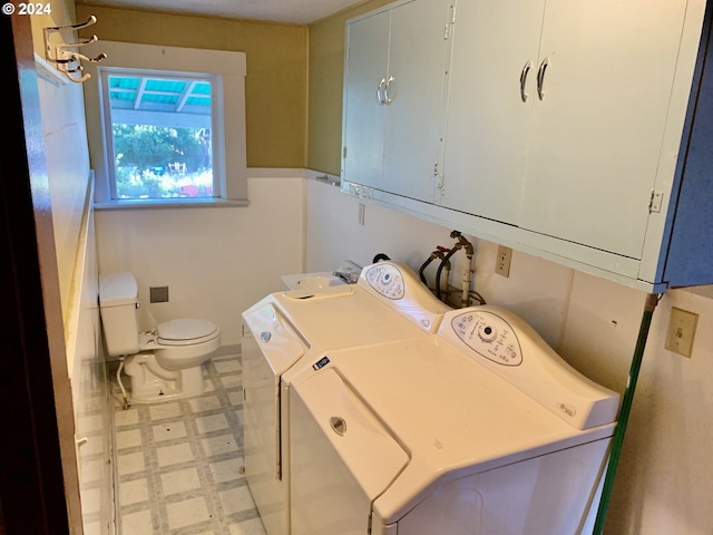 washroom with independent washer and dryer