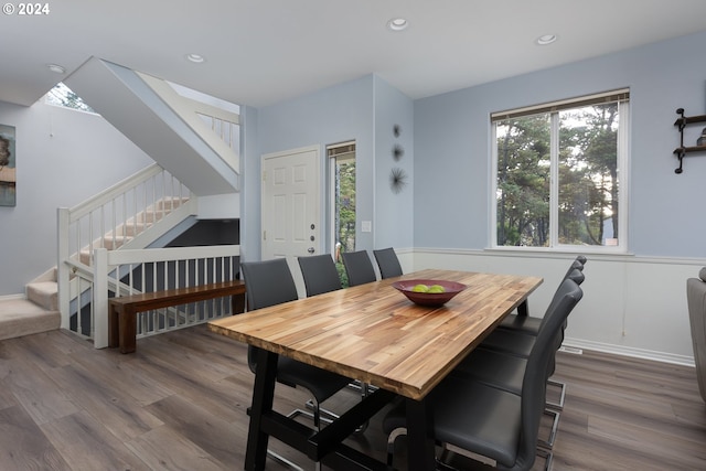 dining space with hardwood / wood-style floors