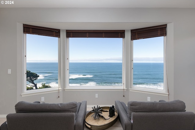 interior space featuring a beach view and a water view