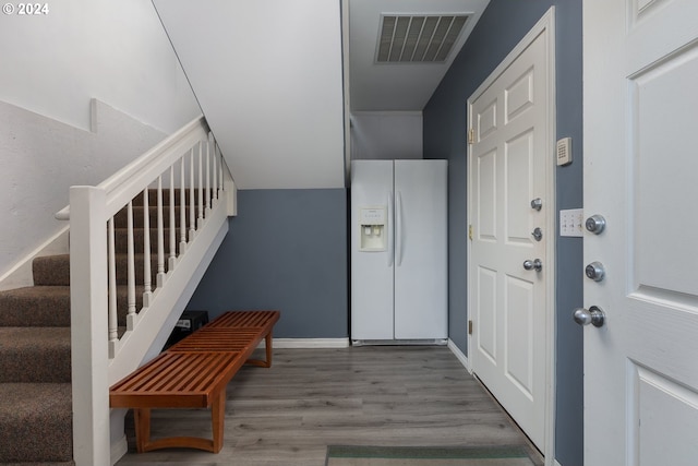 foyer entrance with hardwood / wood-style flooring