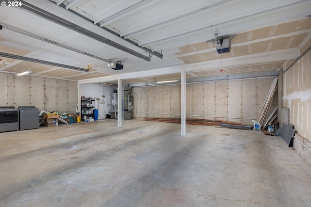 garage with washer and dryer, refrigerator, heating unit, and a garage door opener