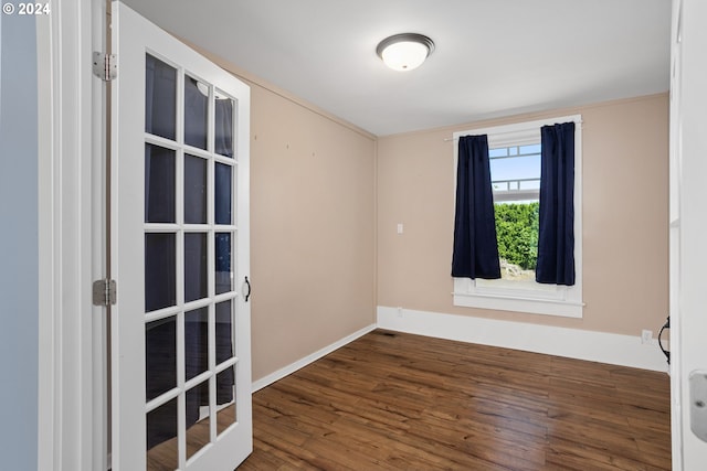 empty room featuring wood-type flooring