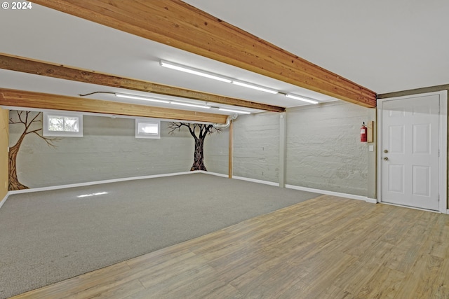 basement featuring hardwood / wood-style floors