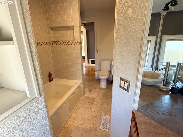 bathroom featuring toilet