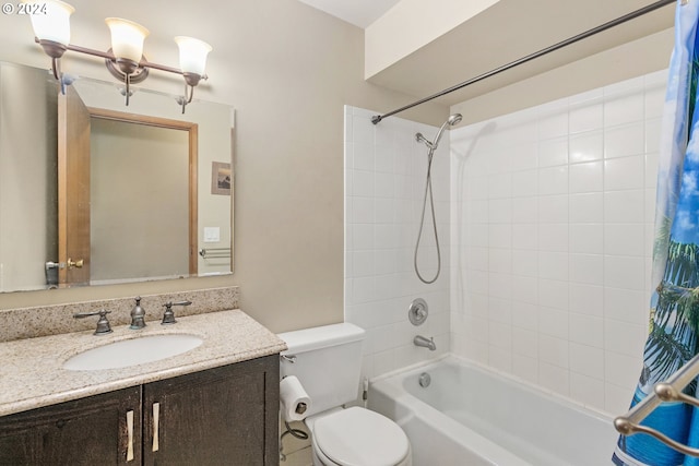 full bathroom featuring vanity, shower / tub combo with curtain, and toilet